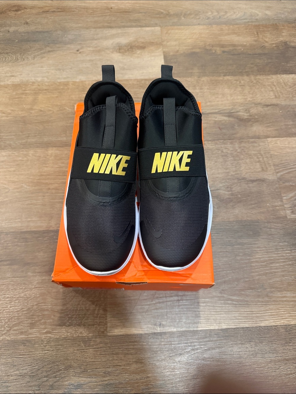 Nike Black Slip-On Sneakers with Yellow Logo
